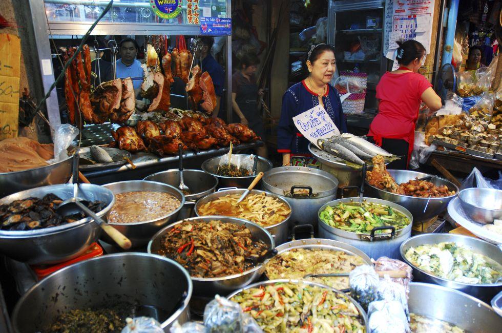 BANGKOK, THAILAND - JANUARY 31: Unidentified female cook variety food at Yaowarat Road in Bangkok's Chinatown district on January 31, 2011 in Bangkok, Thailand; Shutterstock ID 150790835; Project/Title: Photo Database Top 200