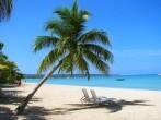 Beach chairs on tropical white sand beach, Negril, Jamaica