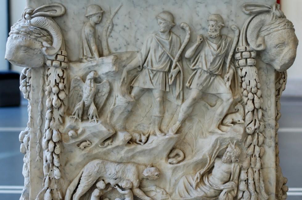 Representation of the lupercal: Romulus and Remus fed by a she-wolf, surrounded by representations of the Tiber and the Palatine. Panel from an alter dedicated to the divine couple of Mars and Venus. Marble, Roman artwork of the end of the reign of Trajan 
