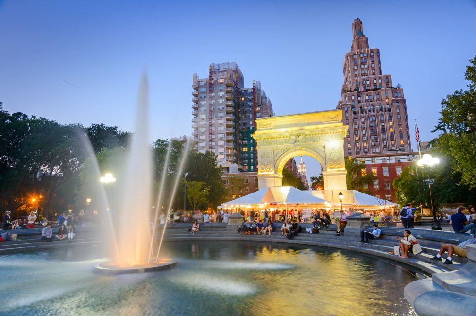 NEW YORK CITY - SEPTEMBER 12, 2012: Crowds gather at Washington Square Park. The historic park is popular in the summer.