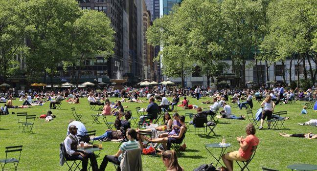 NEW YORK, USA - MAY 16: People enjoying a nice day in Bryant Park on May 16, 2013 in New York City, NY. Bryant Park is a 9,603 acre privately managed park in the center of Manhattan.