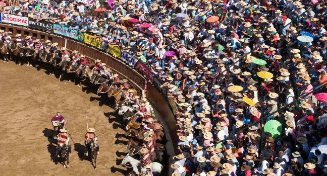 Campeonato Nacional de Rodeo in Rancagua. Viewers see the parade of riders before the rodeo competition.