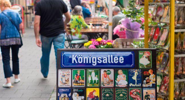 Konigsallee street name sign in dusseldorf, germany. It's famous for the fashion showrooms and luxury retail stores located along its sides. 