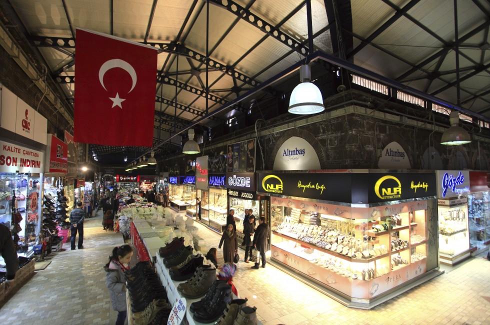 BURSA, TURKEY - MARCH 8: People shopping at Grand Bazaar on March 8, 2013 in Bursa, Turkey. Grand Bazaar was built in 14th century and second biggest bazaar after Istanbul Grand Bazaar in Turkey.; Shutterstock ID 131778212; Project/Title: AARP; Downloader: