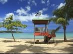 A lifeguard post stands in front of a calm aqua bay at Seven Seas Beach near Fajardo, Puerto Rico; 
