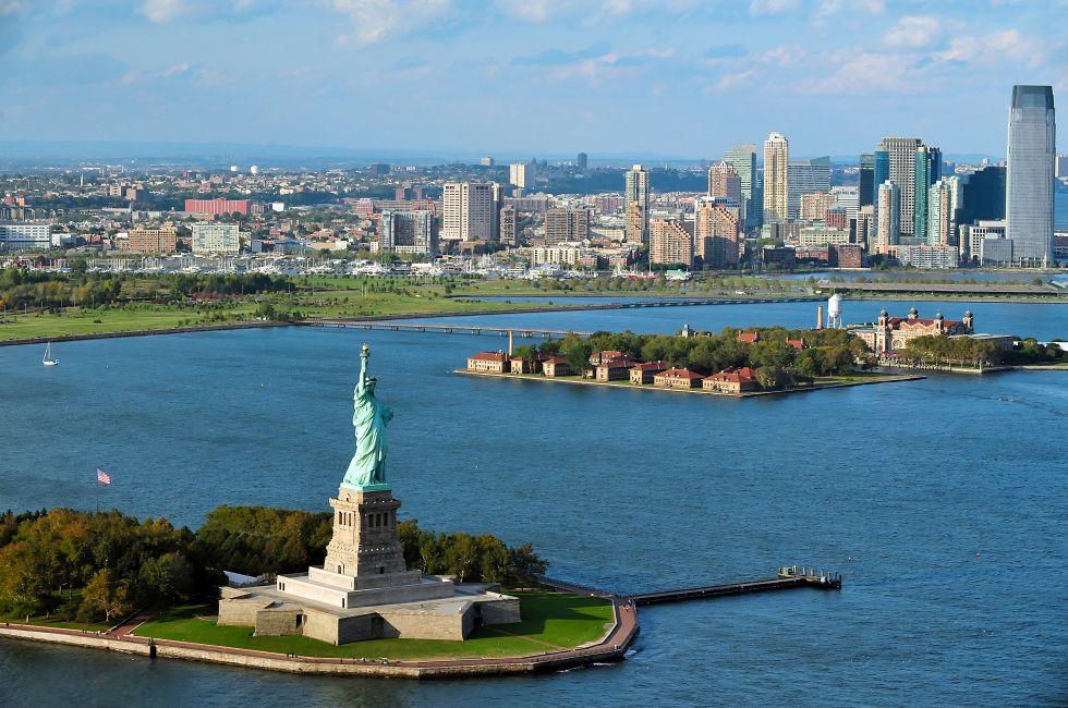 NEW YORK - OCT 15: Aerial view of the Statue of Liberty and Ellis Island on Oct 15 2010. From 1892 to 1954, over 12 million immigrants entered USA through the portal of Ellis Island in New York Harbor; Shutterstock ID 151423415; Project/Title: 10 Things NO