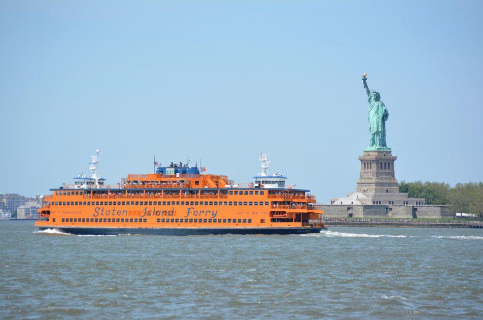 NEW YORK CITY, USA - May 26, 2014: Staten Island Ferry passing the Statue of Liberty in  New York Harbor. ; Shutterstock ID 195164825; Project/Title: 25; Downloader: Fodors Travel