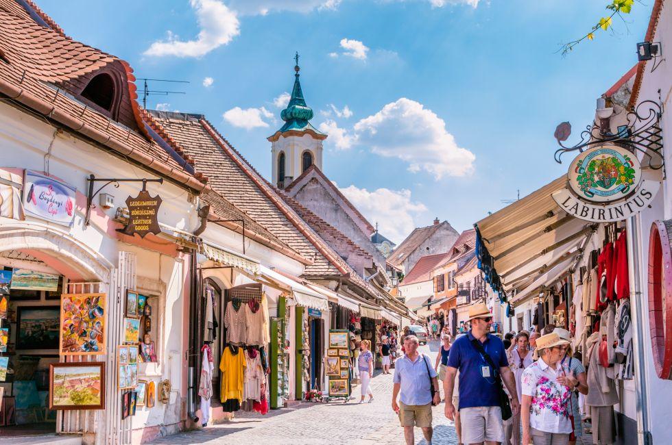 Tourist walking in the main street in the centre of Szentendre a touristic village near Budapest in Hungary. Photo taken on: July 22nd, 2015 